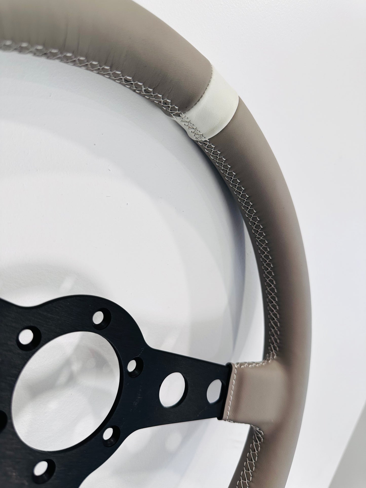 Customize your steering wheel with our bespoke upholstery service. Please provide your steering wheel along with your chosen design and color combination.