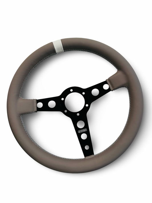 Customize your steering wheel with our bespoke upholstery service. Please provide your steering wheel along with your chosen design and color combination.